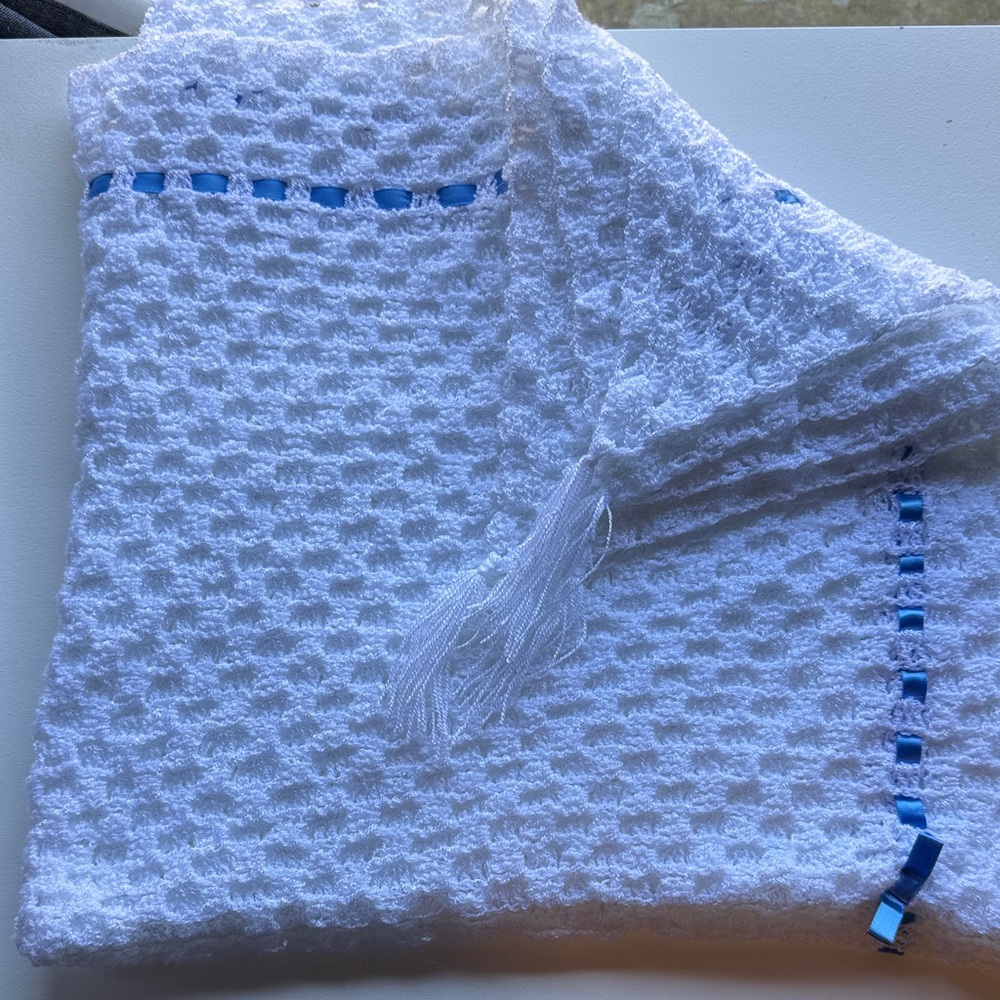 White crocheted baby Blanket with Blue satin ribbon trim